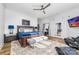 Serene main bedroom with a private balcony, ensuite bathroom, natural light, and a comfortable seating area at 101 N Cove Key Ln, Mooresville, NC 28117