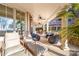 Covered outdoor patio features lounge chairs, wicker seating, and ceiling fans for relaxation at 101 N Cove Key Ln, Mooresville, NC 28117