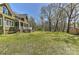 Large backyard with a screened porch, a fire pit area, and a storage shed for ultimate outdoor enjoyment and convenience at 10209 New Town Rd, Marvin, NC 28173