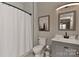 The clean bathroom is highlighted by light grey subway tiles and modern fixtures at 10209 New Town Rd, Marvin, NC 28173