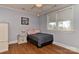 Cozy bedroom with neutral colors, hardwood floors, a ceiling fan, and natural light at 10209 New Town Rd, Marvin, NC 28173