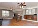 A huge bonus room features a wet bar, TV, comfortable chair, and natural light at 10209 New Town Rd, Marvin, NC 28173