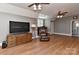 A large bonus room features a TV, comfortable chair, and wet bar at 10209 New Town Rd, Marvin, NC 28173