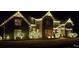 Exterior of home at night with decorative lighting at 10209 New Town Rd, Marvin, NC 28173