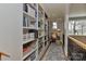 Hallway featuring a large bookcase, reading nook with chair and natural light at 10209 New Town Rd, Marvin, NC 28173