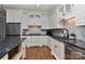 Kitchen with granite countertops, stainless steel appliances and white subway tile backsplash at 10209 New Town Rd, Marvin, NC 28173