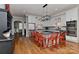 Modern kitchen with white cabinets, granite counters, stainless steel appliances, and red barstools at the island at 10209 New Town Rd, Marvin, NC 28173