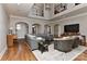 Open-concept living room with hardwood floors, neutral walls, and views of the entryway and adjacent rooms at 10209 New Town Rd, Marvin, NC 28173