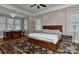Main bedroom with hardwood floors, many windows and a ceiling fan at 10209 New Town Rd, Marvin, NC 28173