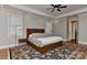 Spacious main bedroom with hardwood floors, many windows, ceiling fan and tray ceilings at 10209 New Town Rd, Marvin, NC 28173