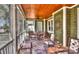 Relax on this amazing screened in porch with wood ceilings and stone floors at 10209 New Town Rd, Marvin, NC 28173