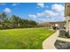 Expansive backyard with lush lawn, fenced perimeter, and outdoor patio area at 1022 Torrens Dr, Monroe, NC 28110