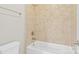 Bright bathroom featuring a shower-over-tub and neutral tile work at 1022 Torrens Dr, Monroe, NC 28110