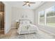 Comfortable bedroom with a ceiling fan and a bright window view at 1022 Torrens Dr, Monroe, NC 28110