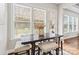 Bright breakfast nook featuring a dark table with seating for four at 1022 Torrens Dr, Monroe, NC 28110