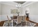 Formal dining room with stylish chandelier and wainscoting, perfect for hosting dinner parties at 1022 Torrens Dr, Monroe, NC 28110