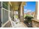 Inviting covered porch with stone pillars and cozy seating area at 1022 Torrens Dr, Monroe, NC 28110