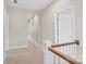 Second floor hallway with neutral walls and carpet at 1022 Torrens Dr, Monroe, NC 28110