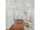 Bright hallway features hardwood flooring, decorative lighting, and traditional decor at 1022 Torrens Dr, Monroe, NC 28110