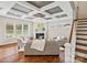 Cozy living room features a fireplace, coffered ceilings, hardwood floors and lots of natural light at 1022 Torrens Dr, Monroe, NC 28110