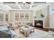 Cozy living room features a fireplace, coffered ceilings, hardwood floors and lots of natural light at 1022 Torrens Dr, Monroe, NC 28110