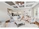 Bright open-plan living room features a fireplace, coffered ceilings, hardwood floors and lots of natural light at 1022 Torrens Dr, Monroe, NC 28110