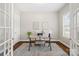 Bright home office with French doors, natural light, and a comfortable workspace at 1022 Torrens Dr, Monroe, NC 28110