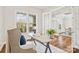 Inviting home office featuring a large window, French doors, and a modern desk setup at 1022 Torrens Dr, Monroe, NC 28110