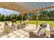 Large patio with pergola and comfortable outdoor seating, ideal for enjoying outdoor living at 1022 Torrens Dr, Monroe, NC 28110