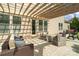 Inviting covered patio with comfortable seating and outdoor grill, perfect for entertaining at 1022 Torrens Dr, Monroe, NC 28110