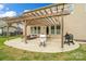 Spacious outdoor patio with a wooden pergola, offering ample space for relaxation and outdoor dining at 1022 Torrens Dr, Monroe, NC 28110