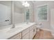 Bright bathroom featuring double vanity, tile flooring, and a view into the bathroom at 1061 Verbena Ct, Tega Cay, SC 29708