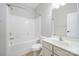 Bright bathroom featuring tile flooring, toilet, vanity, shower and soaking tub at 1061 Verbena Ct, Tega Cay, SC 29708