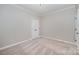 Neutral bedroom featuring carpet, crown molding, and a double door closet at 1061 Verbena Ct, Tega Cay, SC 29708