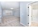 Open bonus room with natural light, neutral carpet, and attached bathroom at 1061 Verbena Ct, Tega Cay, SC 29708