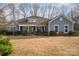 Charming single Gathering home featuring a cozy front porch and beautiful stone accents at 1061 Verbena Ct, Tega Cay, SC 29708