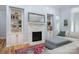 Cozy living room with a beautiful fireplace, built-in shelving, and a comfortable seating area, perfect for relaxing at 1061 Verbena Ct, Tega Cay, SC 29708