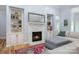 Inviting living room with a stone fireplace, built-in shelving, and a comfortable seating area at 1061 Verbena Ct, Tega Cay, SC 29708