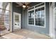 Relaxing screened in porch with ceiling fan, concrete floor, and backyard view at 1061 Verbena Ct, Tega Cay, SC 29708