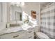 This beautifully renovated bathroom features a marble vanity, gold fixtures, and a shower/tub combo at 1081 Evergreen Cir, Rock Hill, SC 29732