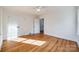 This bright, spacious bedroom features beautiful hardwood floors and a modern ceiling fan at 1081 Evergreen Cir, Rock Hill, SC 29732