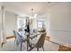 Dining room features a glass table, modern chandelier, and light-colored walls at 1081 Evergreen Cir, Rock Hill, SC 29732