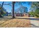 Charming brick home with a well-manicured front yard and a long driveway for plenty of parking at 1081 Evergreen Cir, Rock Hill, SC 29732