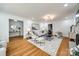 Open concept living room with hardwood floors, modern furniture, and access to other rooms at 1081 Evergreen Cir, Rock Hill, SC 29732
