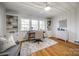 Bright home office featuring hardwood floors, built-in shelves, and lots of windows at 1081 Evergreen Cir, Rock Hill, SC 29732