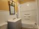 Bathroom with tub and shower combination and painted yellow walls at 109 Oakland Ave, Chester, SC 29706