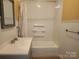 Bathroom with tub and shower combination and neutral cabinets at 109 Oakland Ave, Chester, SC 29706