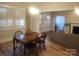 Bright dining room featuring plantation shutters and a classic chandelier above a wood table at 109 Oakland Ave, Chester, SC 29706