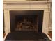 Traditional fireplace featuring a white mantel and dark brick interior, perfect for cozy evenings at 109 Oakland Ave, Chester, SC 29706