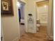 Hallway view of bedroom and bathroom with hardwood style flooring at 109 Oakland Ave, Chester, SC 29706